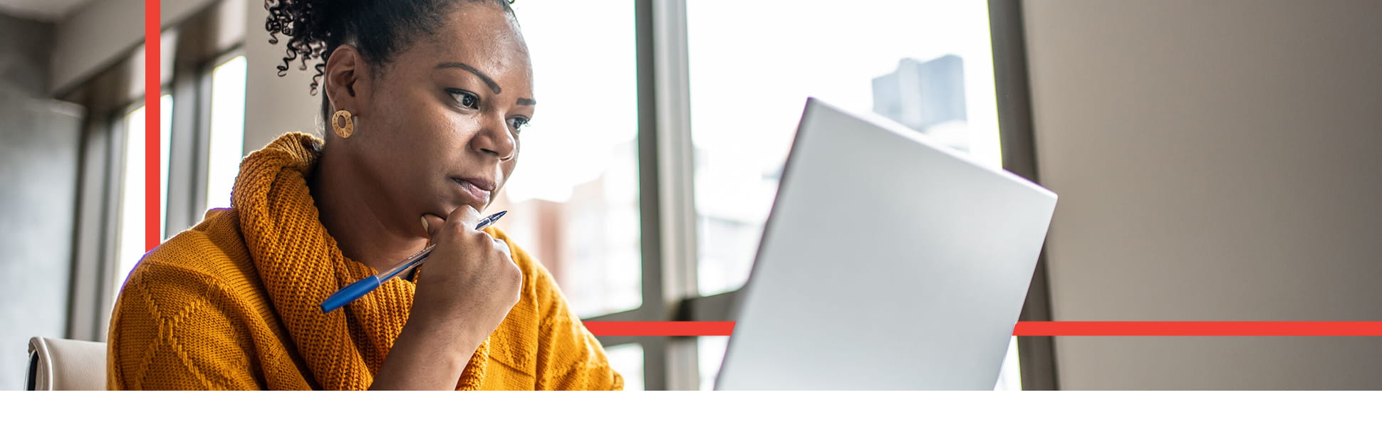 Female SME owner working on a laptop