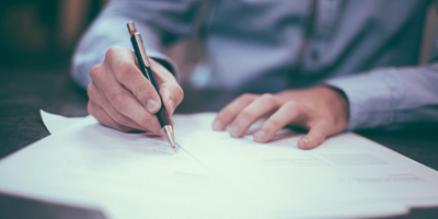 Business man signing documents