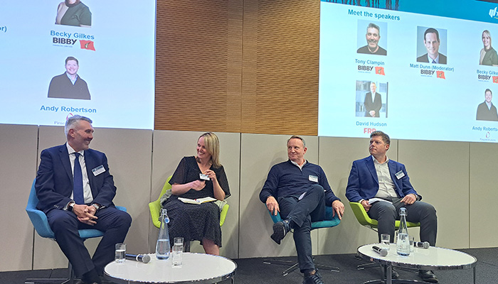 Four people sat on stage for TMA Construction Event