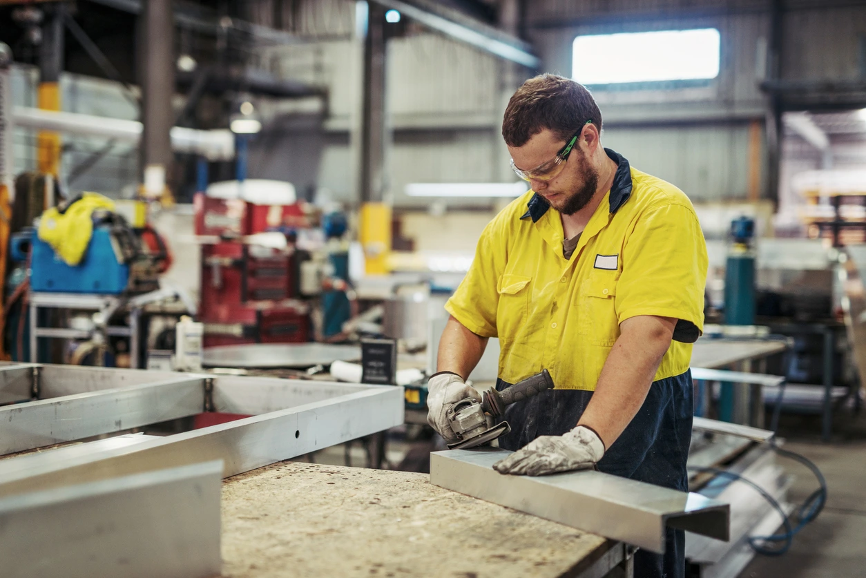 Worker using an angle grinder