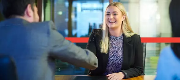 Woman smiling in meeting