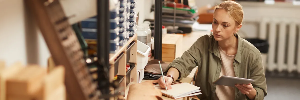 People shaking hands in carpentry workshop