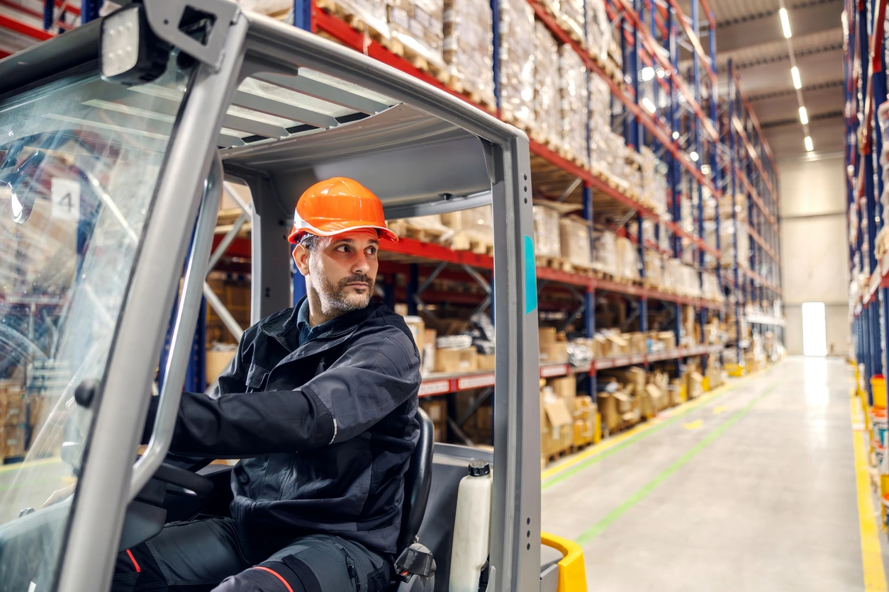 Man operating forklift